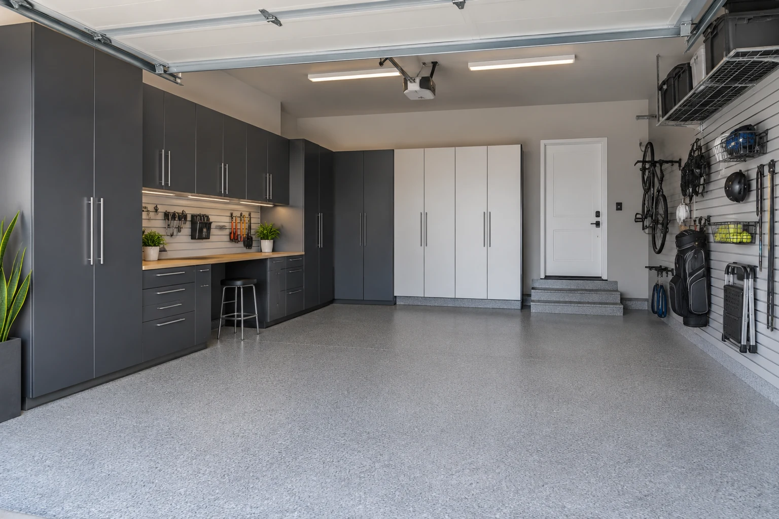 Illustrative garage with fitted cabinets and organized storage